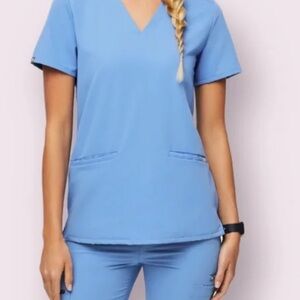Figs womans blue scrub set top and bottom size xs (some stains)